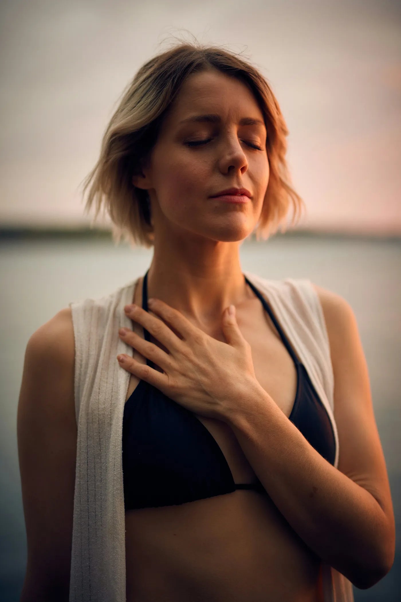 woman with hand over heart self-love