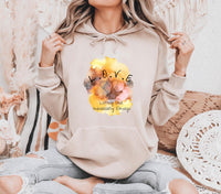 Thumbnail for a woman sitting on a bed wearing a hoodie