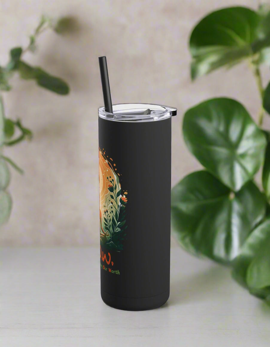 a black tumbler cup with a straw in it