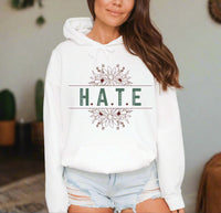 Thumbnail for a woman wearing a white hoodie that says hate