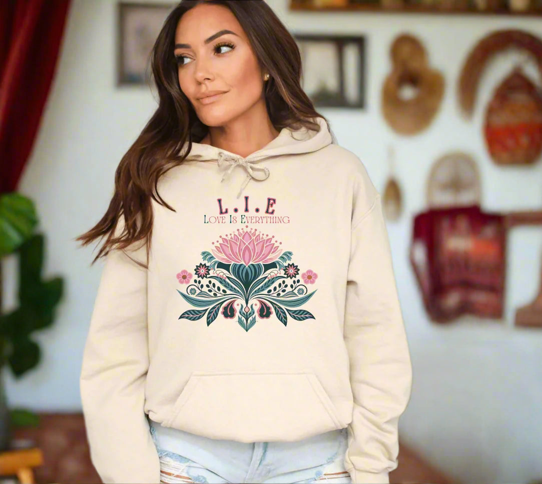 a woman wearing a hoodie with a flower on it