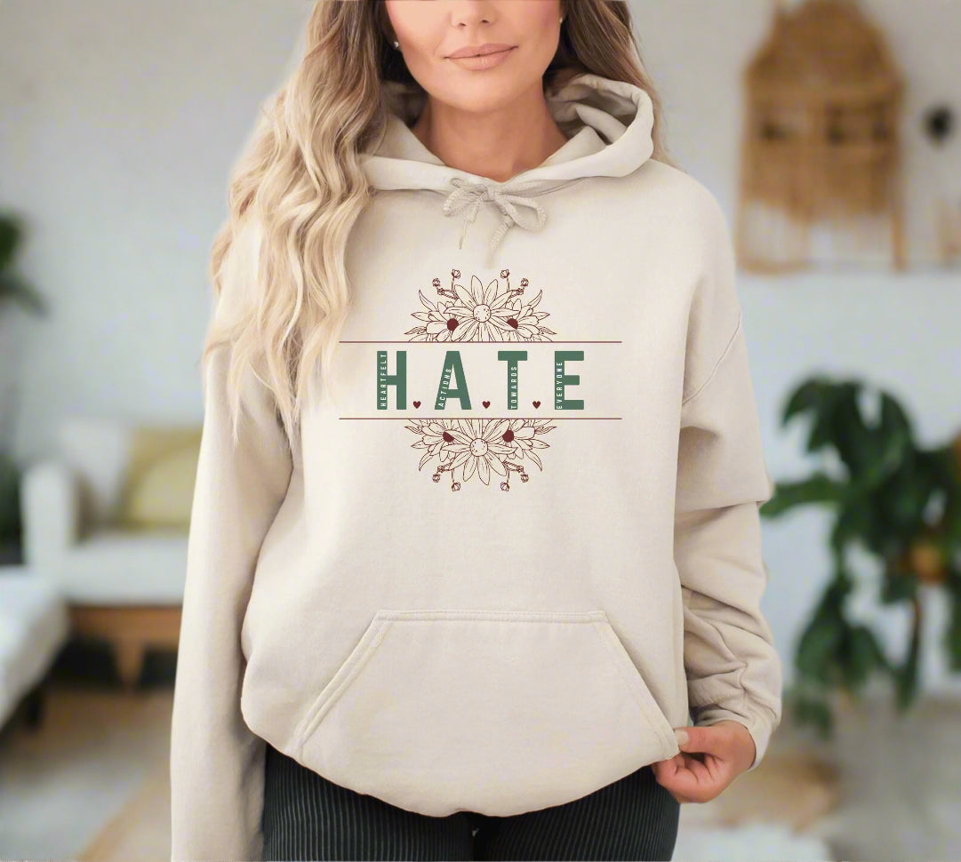 a woman wearing a hoodie that says hate