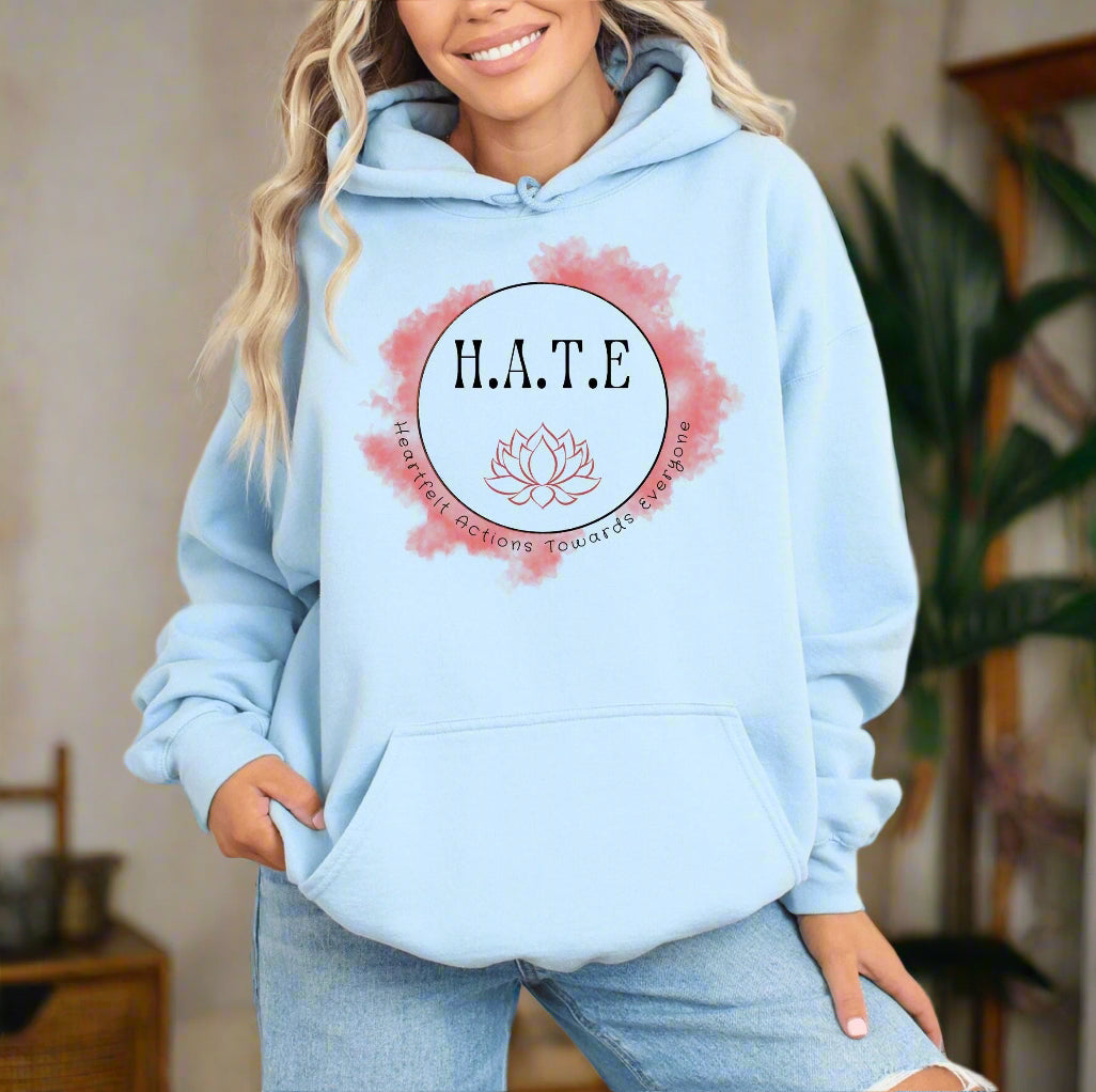 a woman wearing a blue hoodie with the words hate on it