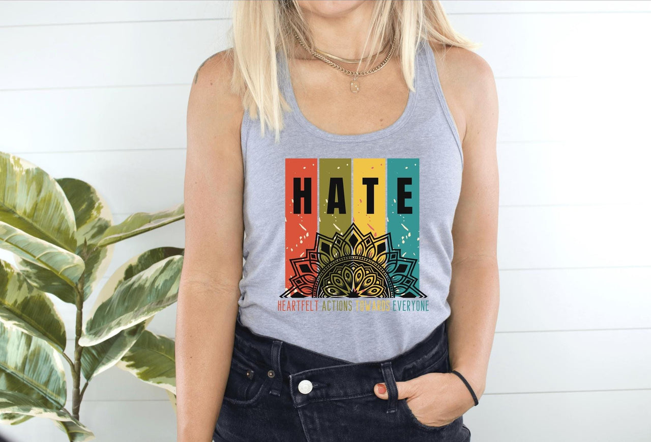 a woman wearing a tank top with the word hate on it