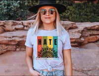 Thumbnail for a woman wearing a hat and sunglasses standing in front of a rock wall