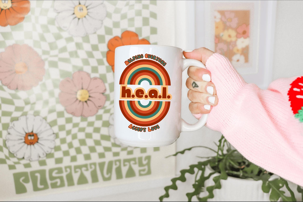 a person holding a coffee mug in their hand