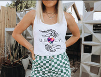 Thumbnail for a woman wearing a white tank top and green checkered shorts
