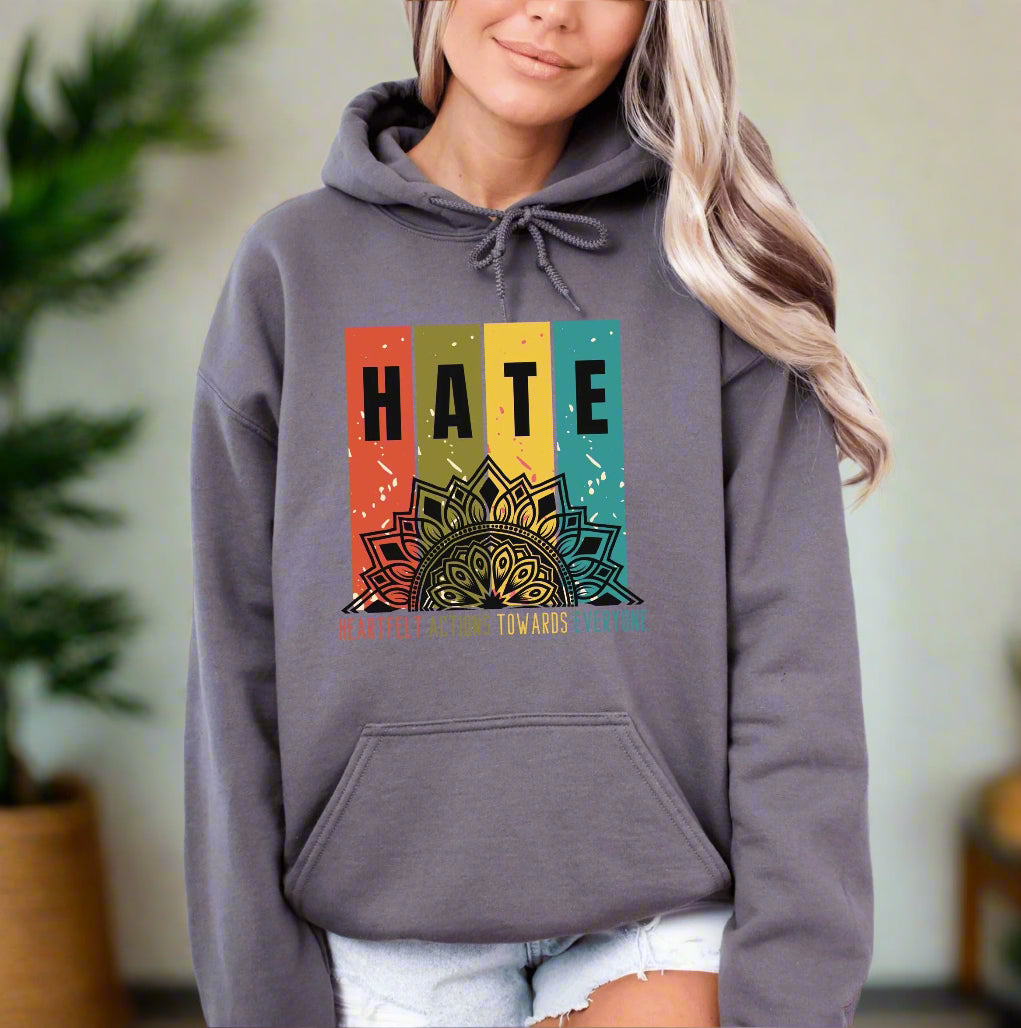 a woman wearing a hoodie with the words hate on it