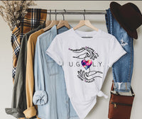 Thumbnail for a t - shirt and jeans hanging on a rack