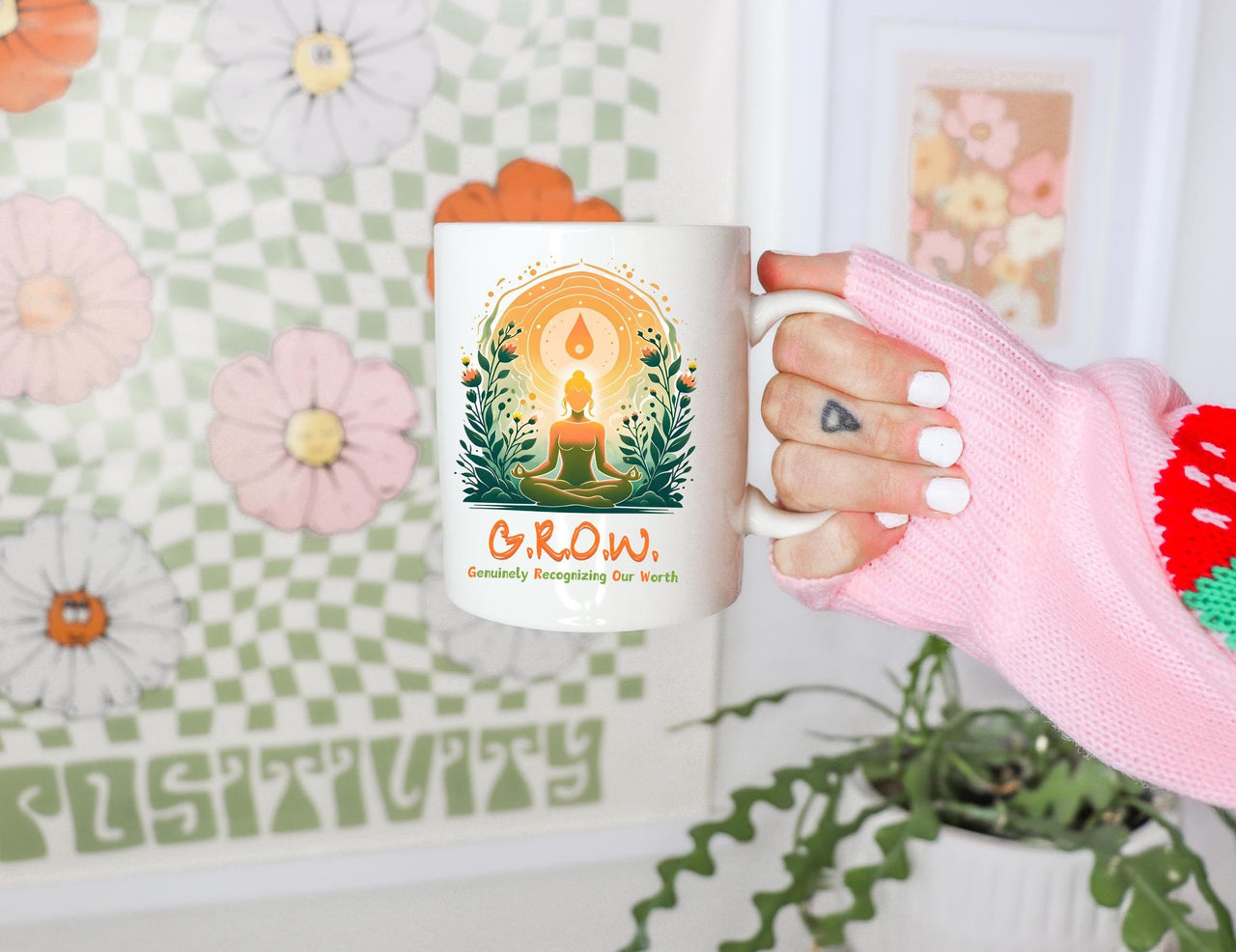 a person holding a coffee mug in their hand