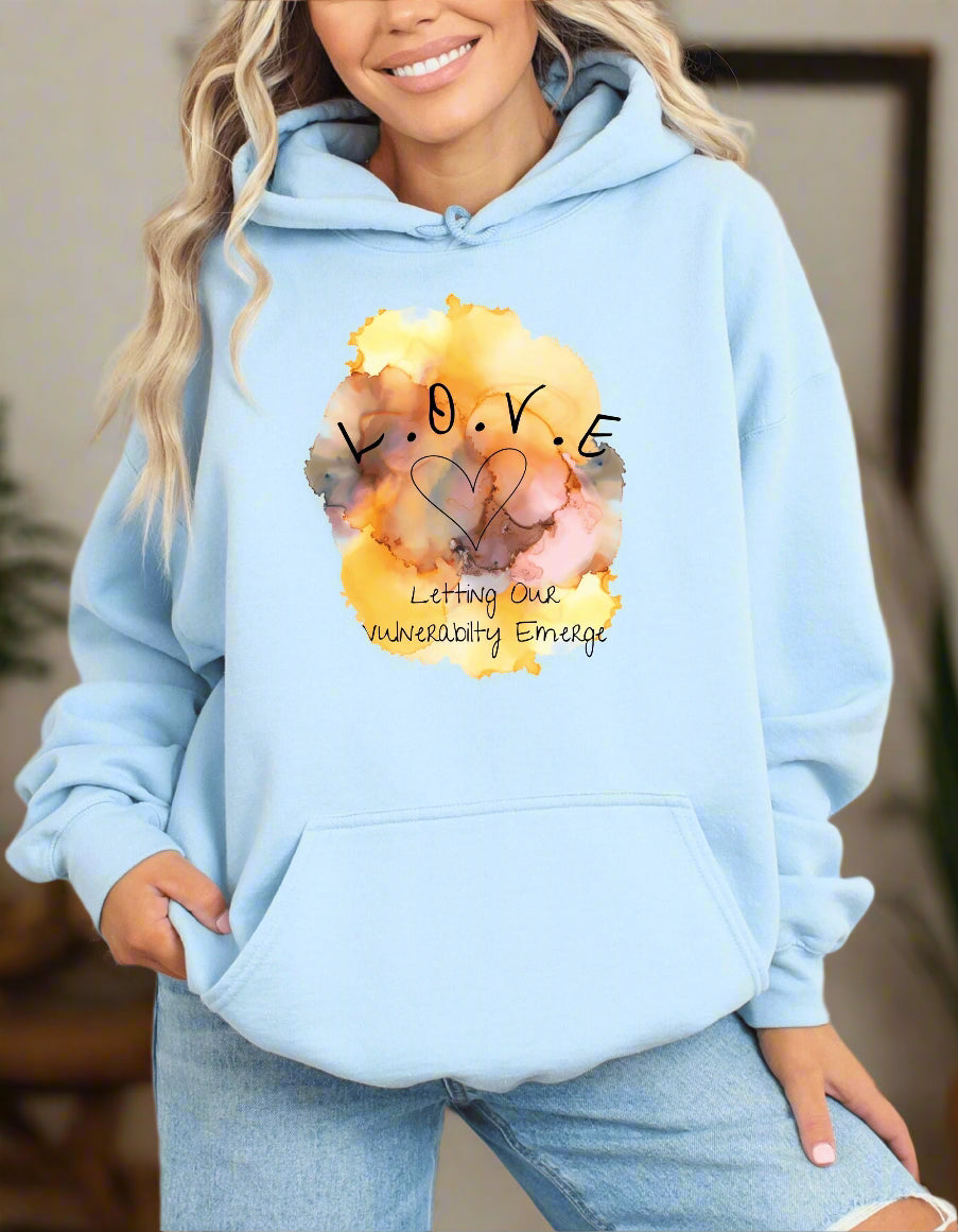 a woman wearing a blue hoodie that says love