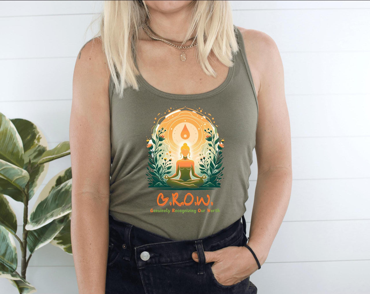 a woman wearing a tank top with a tree on it