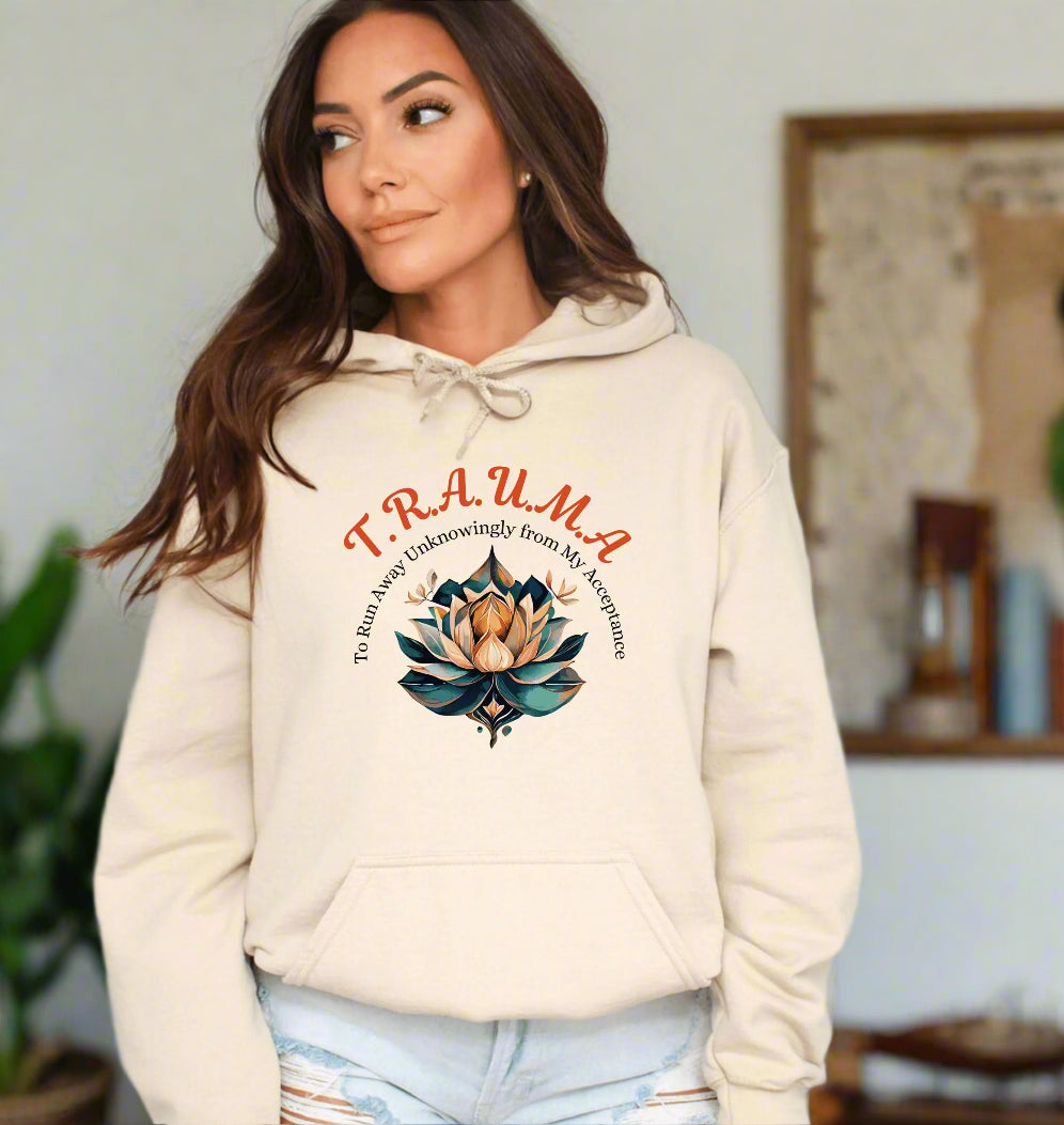 a woman wearing a sweatshirt with a lotus on it