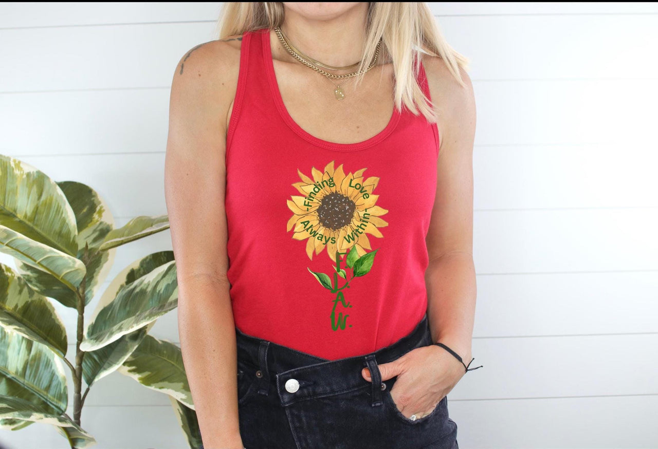 a woman wearing a red tank top with a sunflower on it