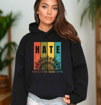 Thumbnail for a woman wearing a black hoodie with the words hate on it