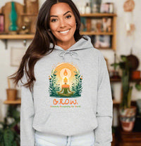 Thumbnail for a woman wearing a grey hoodie with the words grow on it