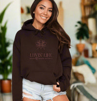 Thumbnail for a woman wearing a brown hoodie that says luvin'life