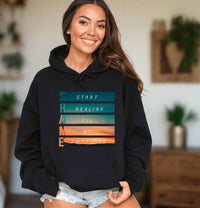 Thumbnail for a woman wearing a black hoodie with the words start healing on it