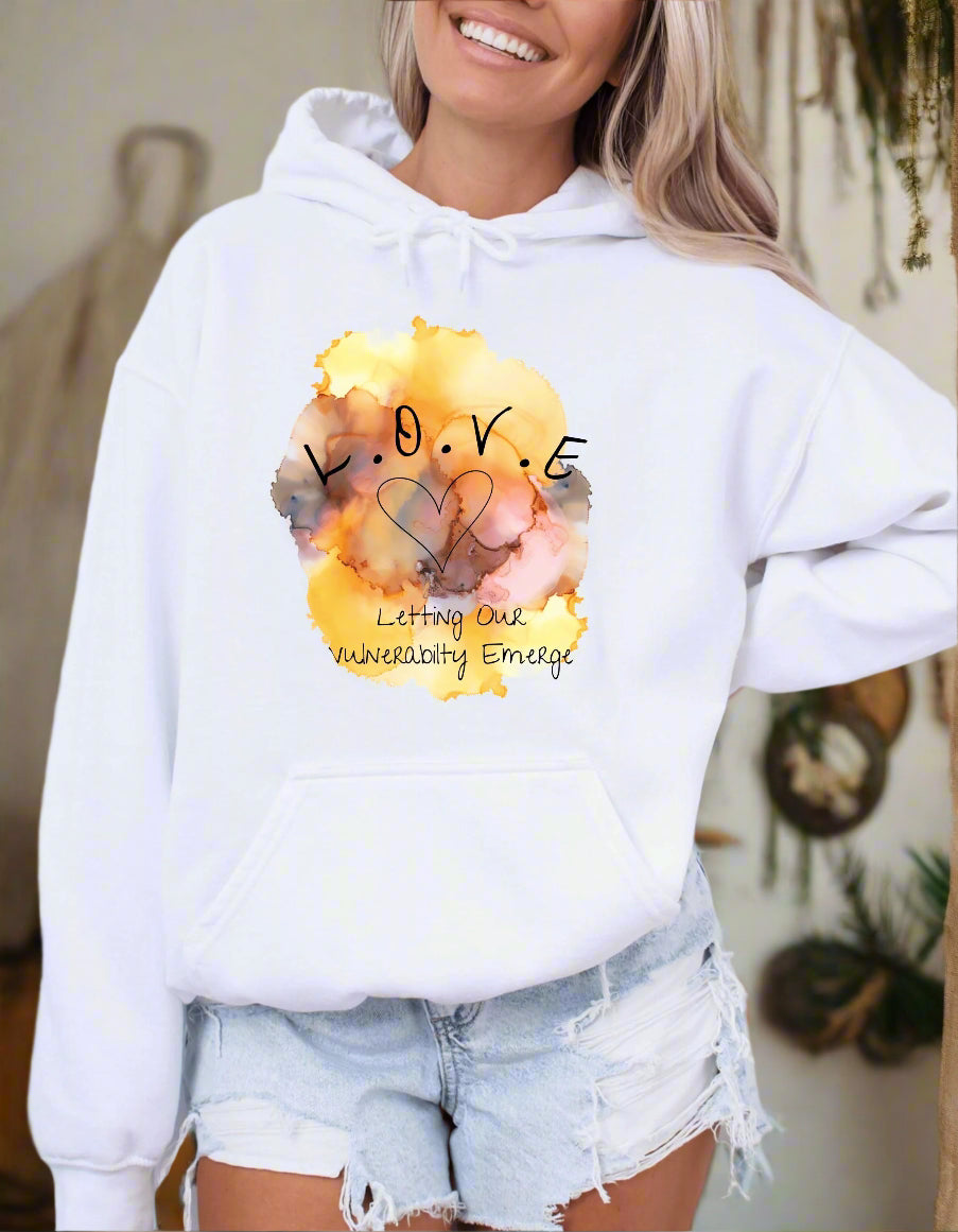 a woman wearing a white hoodie with a watercolor painting on it