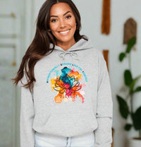 Thumbnail for a woman wearing a grey hoodie with a colorful flower on it