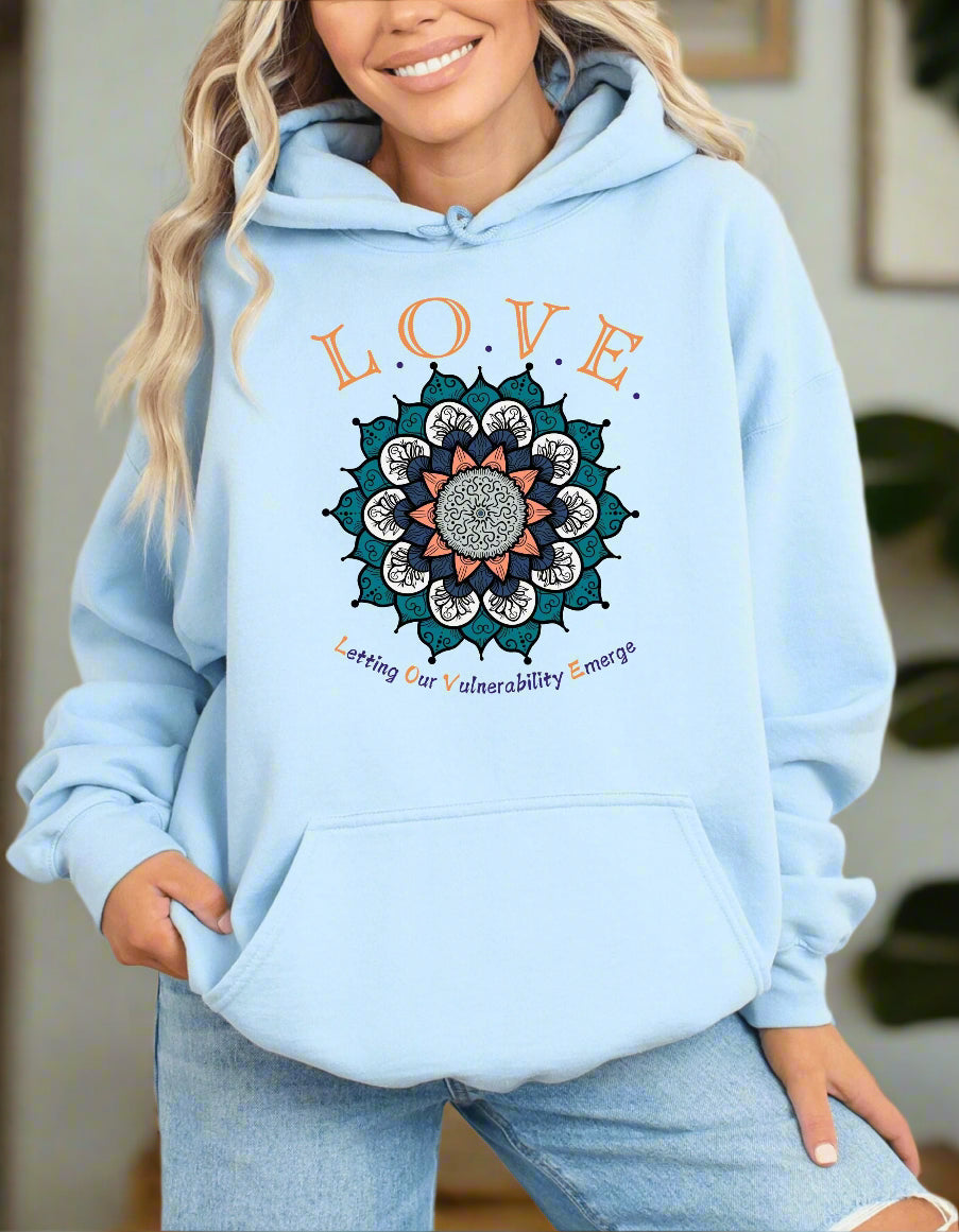 a woman wearing a blue hoodie with the words love on it