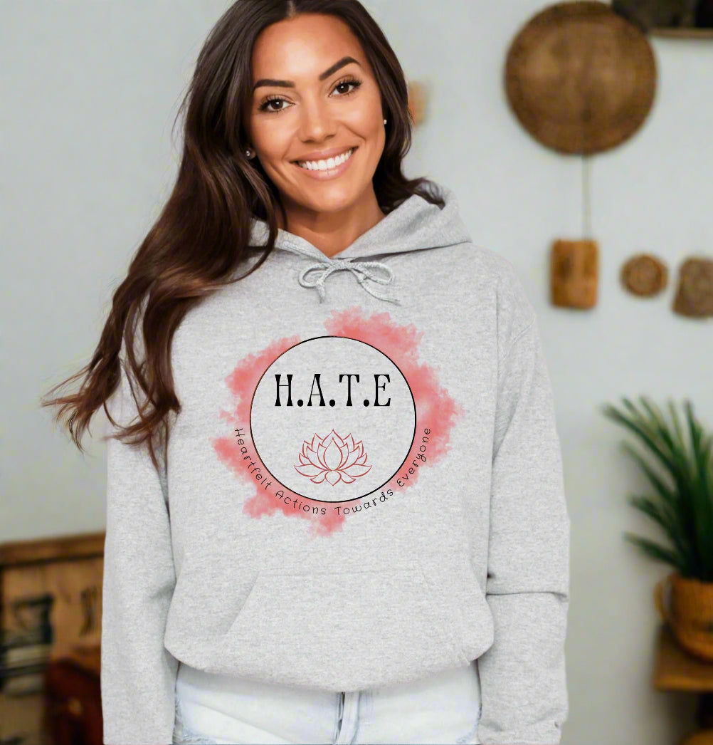 a woman wearing a grey hoodie with the word hate on it