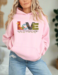 Thumbnail for a woman wearing a pink hoodie with the words love on it
