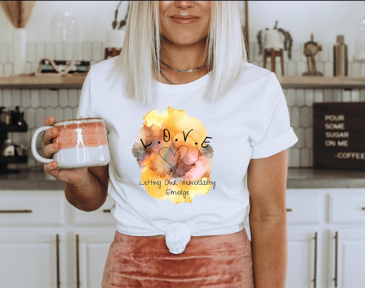 a woman holding a mug in her hands