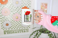 Thumbnail for a person holding a coffee mug with a flower on it