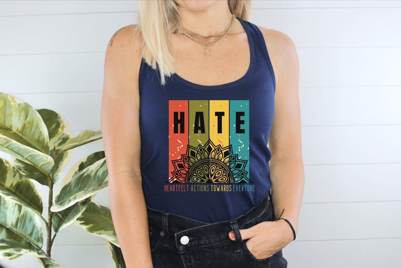 a woman wearing a tank top with the word hate on it