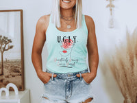 Thumbnail for a woman wearing a light blue tank top with the words u g y on it