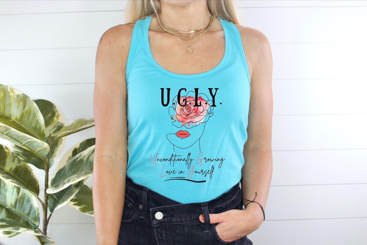 a woman wearing a blue tank top with a flower on it