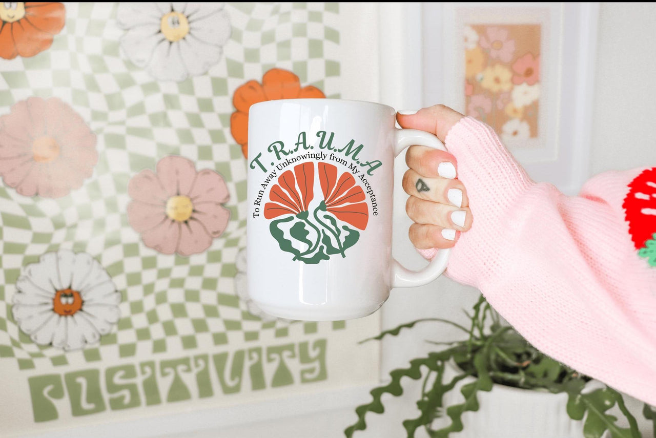 a person holding a coffee mug in their hand