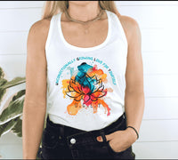 Thumbnail for a woman wearing a white tank top with a colorful lotus on it