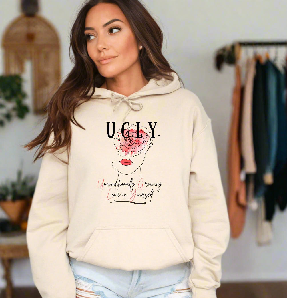 a woman wearing a hoodie with a rose on it