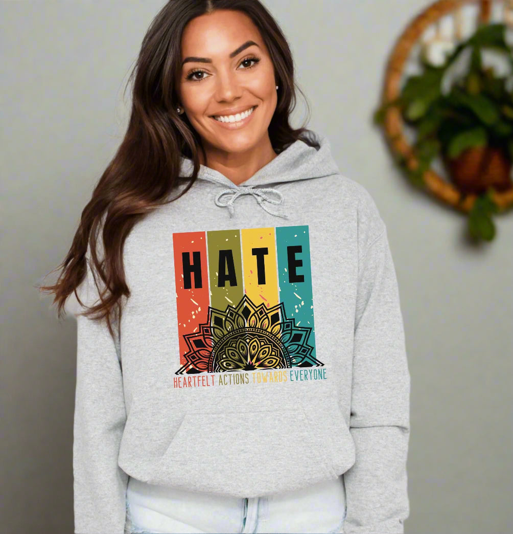 a woman wearing a hoodie with the words hate on it