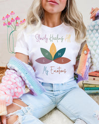 Thumbnail for a woman wearing a t - shirt with a flower on it