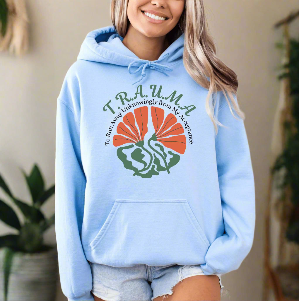 a woman wearing a light blue hoodie with a turkey on it