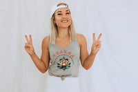 Thumbnail for a woman in a tank top is making a peace sign