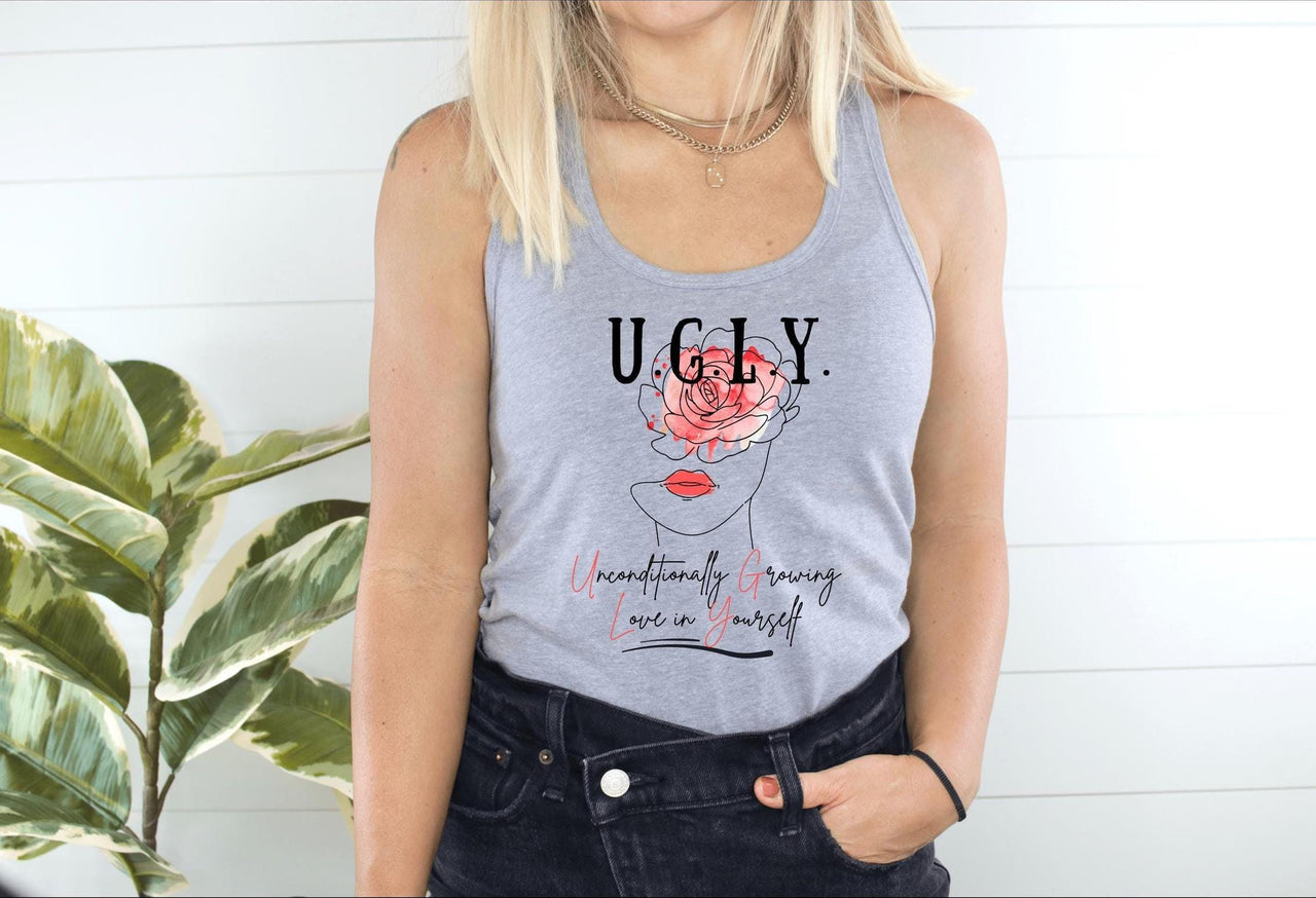 a woman wearing a tank top with a flower on it