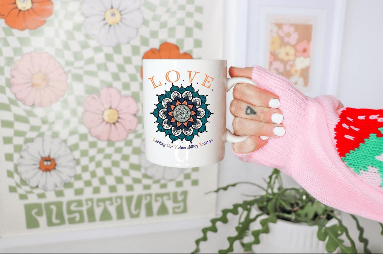 a person holding a coffee mug in their hand