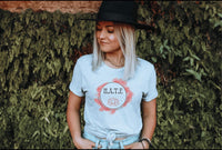 Thumbnail for a woman wearing a hat standing in front of a wall