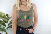 Thumbnail for a woman standing next to a plant wearing a tank top