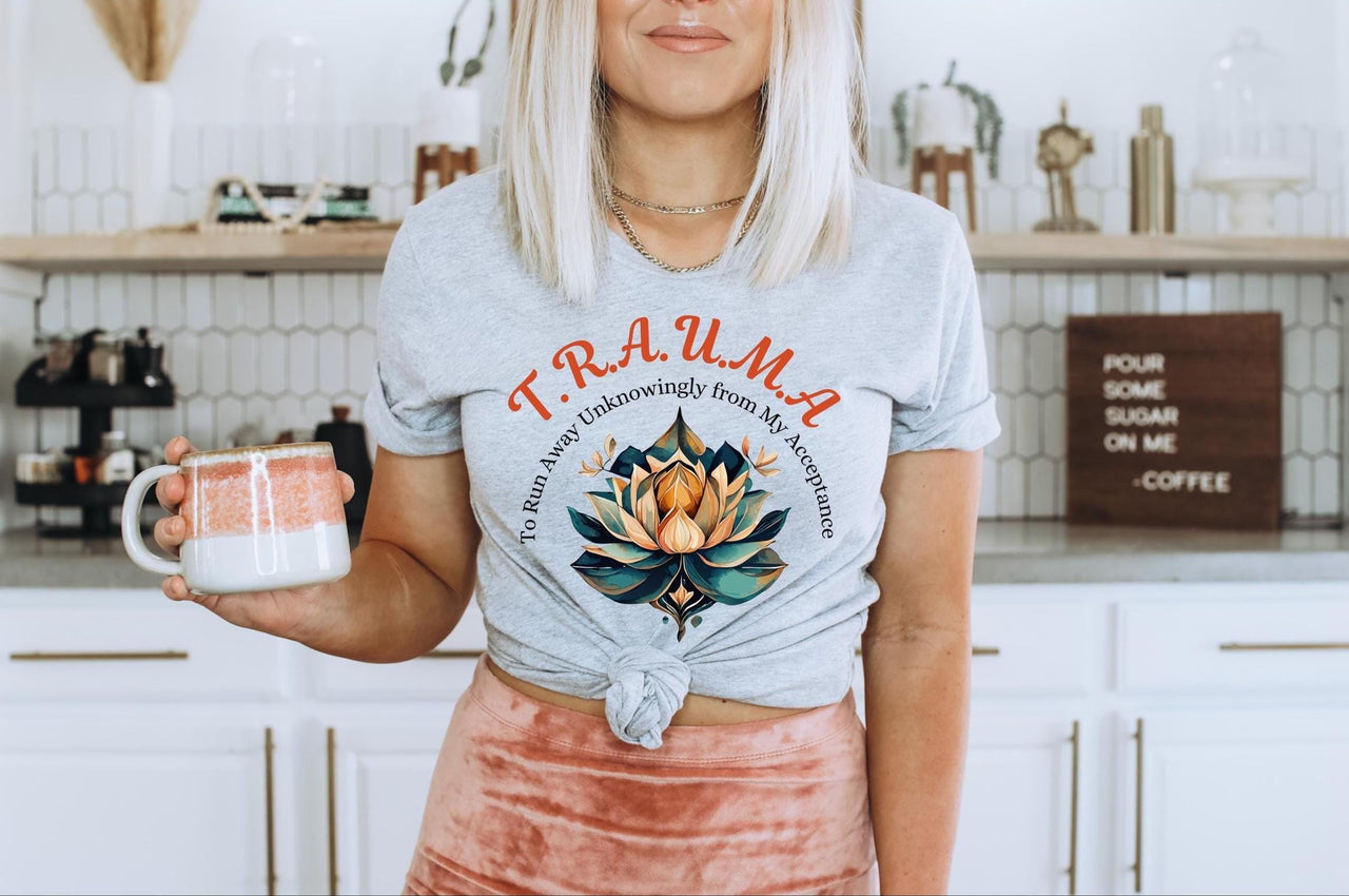 a woman standing in a kitchen holding a mug