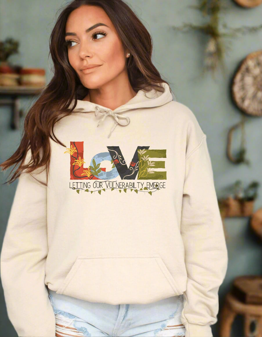 a woman wearing a sweatshirt with the words love on it