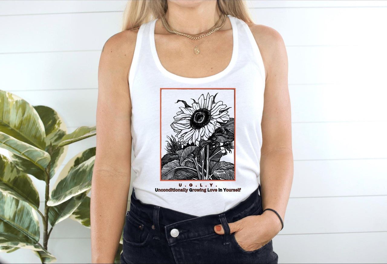 a woman wearing a white tank top with a sunflower on it