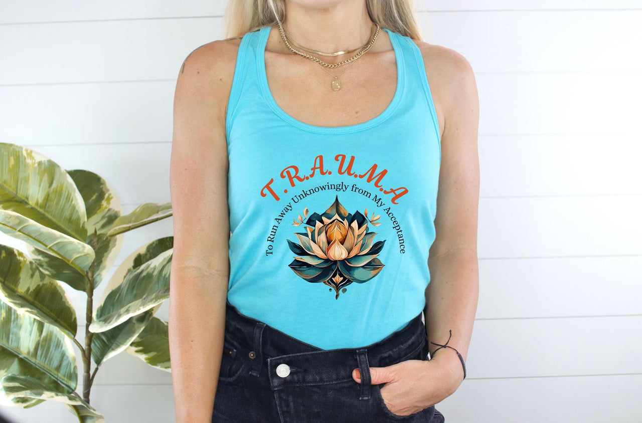 a woman wearing a tank top with a flower on it