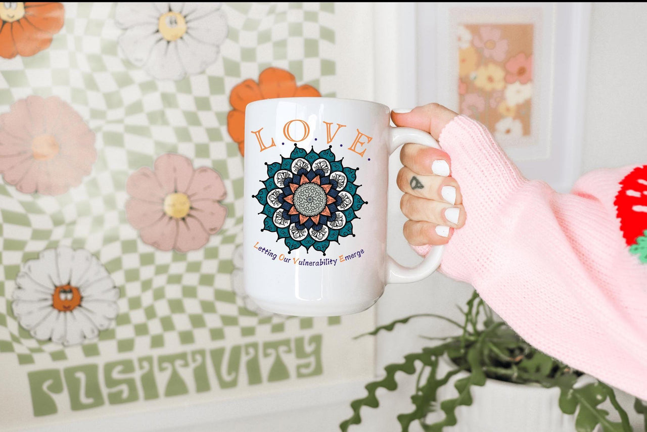 a person holding a coffee mug in their hand