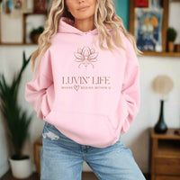Thumbnail for a woman wearing a pink hoodie that says luvin'life