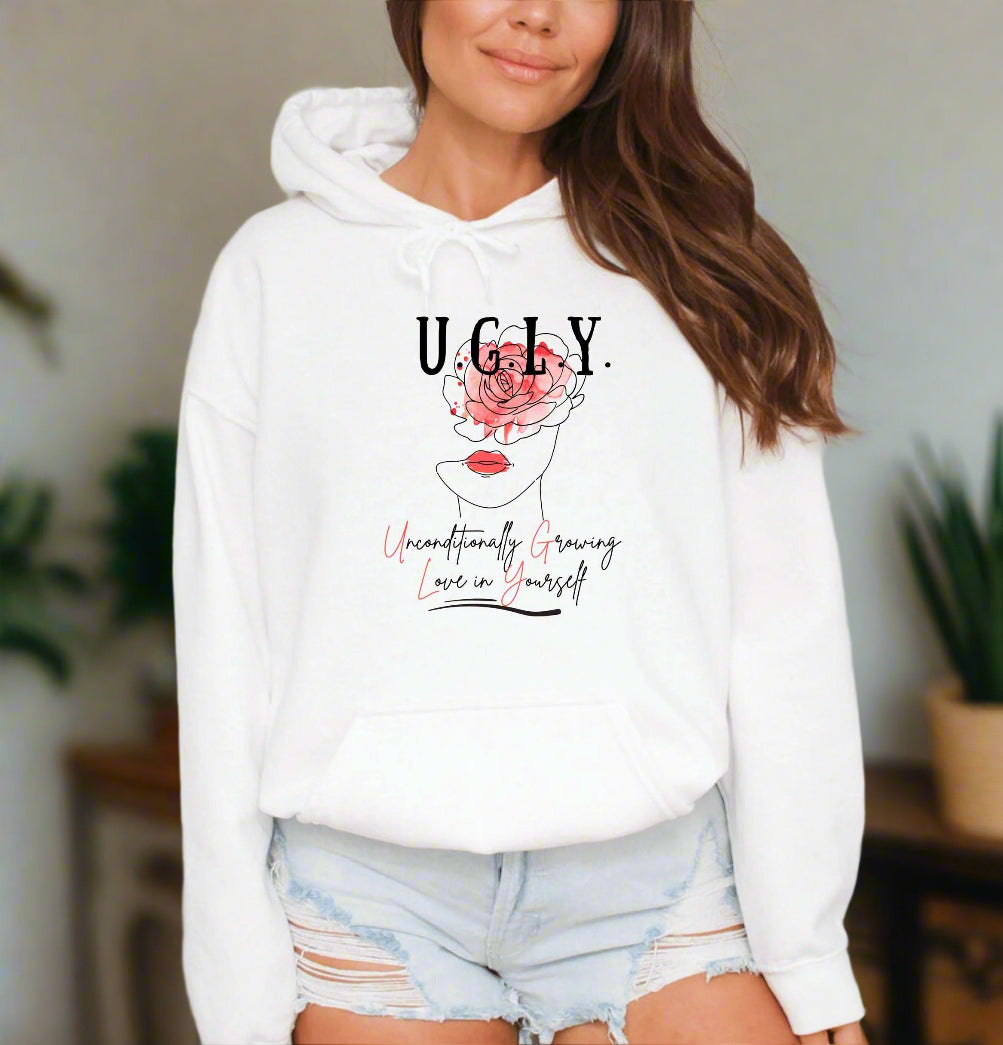 a woman wearing a white hoodie with a rose on it